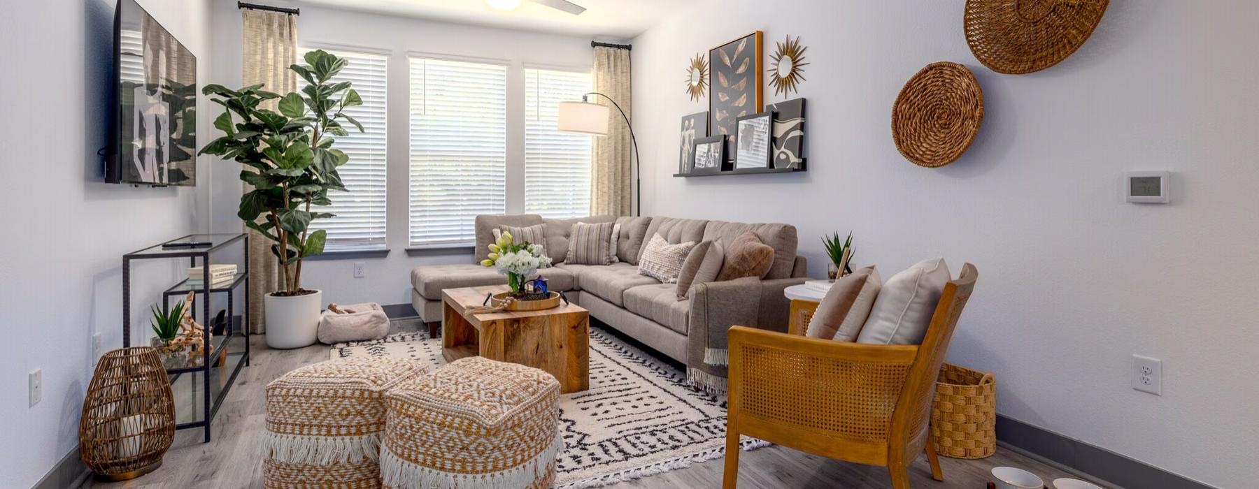 a living room with a tv seating and table